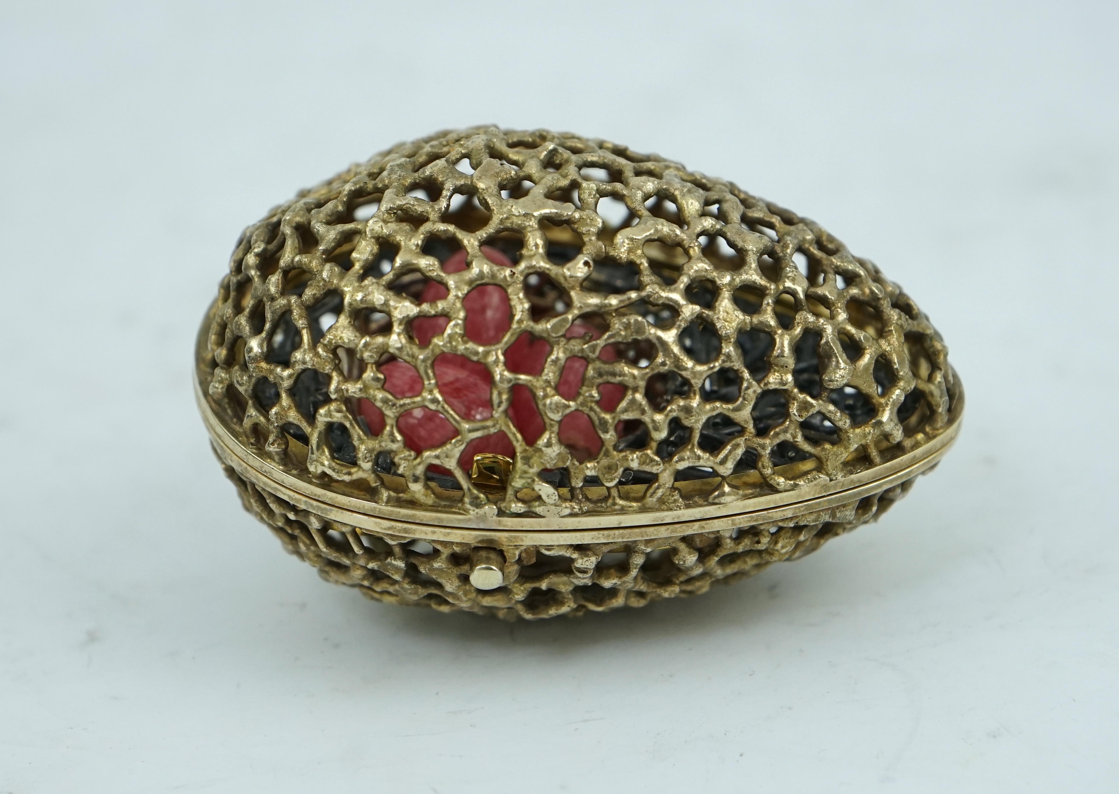 An Elizabeth II pierced silver gilt surprise egg by Stuart Devlin